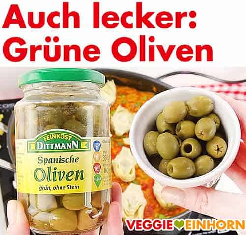 Ein Glas grüne Oliven