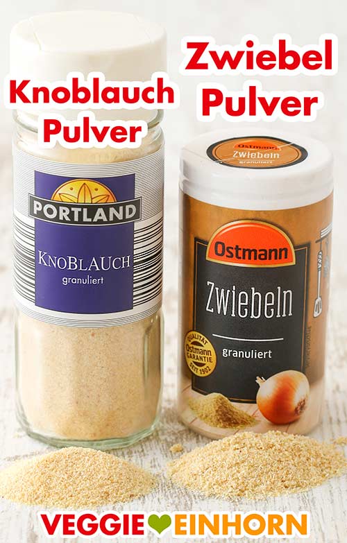 Knoblauchpulver und Zwiebelpulver Ein Glas Knoblauchpulver und eine Dose Zwiebelpulver