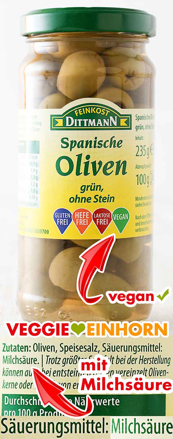 Oliven mit veganer Milchsäure Ein Glas Oliven