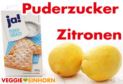 Eine Packung Puderzucker und zwei Zitronen