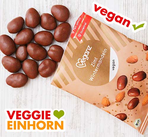 Veganz Zimt Wintermandeln Eine geöffnete Packung vegane Zimt Wintermandeln von Veganz