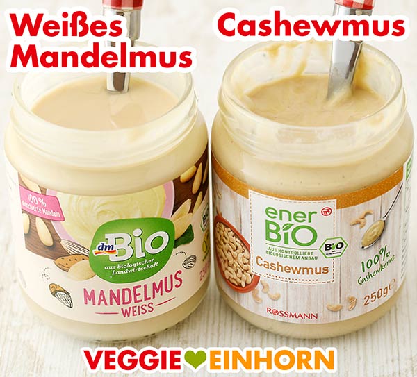 Nussmus macht die vegane Knoblauchsauce cremig. Ein Glas weißes Mandelmus und ein Glas Cashewmus