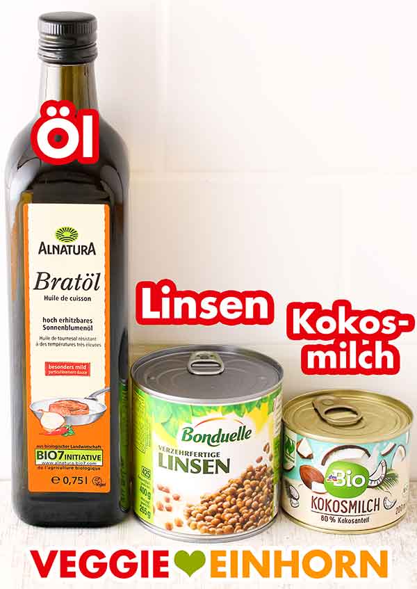 Alnatura Bratöl, Bonduelle Dosenlinsen, dm Bio Kokosmilch Eine Flasche Bratöl, eine Dose Linsen und eine kleine Dose Kokosmilch.