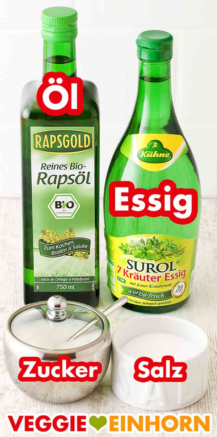 Rapsgold Bio Rapsöl, Kühne Surol 7 Kräuter Essig, Zucker, Salz Eine Flasche Öl, eine Flasche Essig, eine Zuckerdose und ein Salztopf