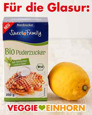 Puderzucker und Zitrone für die Glasur Eine Packung Puderzucker und eine Zitrone