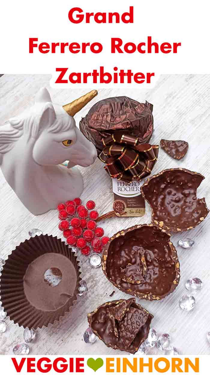 Das vegane Grand Ferrero Rocher schmeckt okay, aber nicht überragend. Zerbrochene Schokolade und die Verpackung des Grand Ferrero Rocher Zartbitter.
