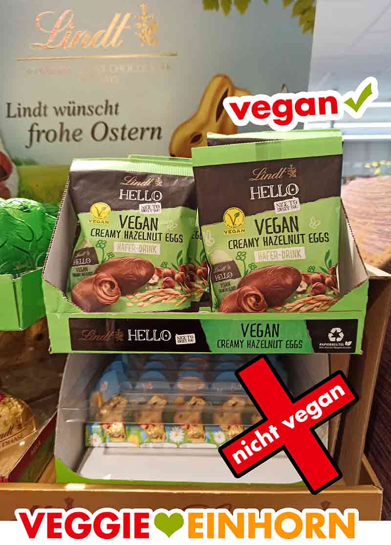 Die veganen gefüllten Nougat Ostereier von Lindt HELLO im Supermarkt Lindt HELLO Vegan Creamy Hazelnut Eggs im Aufsteller mit Ostersüßigkeiten bei Edeka