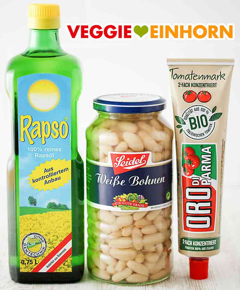 Rapso Rapsöl, Seidel Weiße Bohnen, Oro di Parma Tomatenmark Eine Flasche Rapsöl, ein Glas weiße Bohnen und eine Tube Tomatenmark